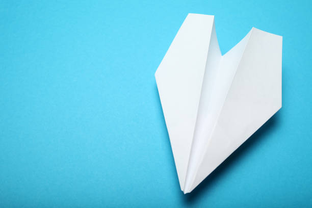 istock White paper origami aircraft concept. 1068665686