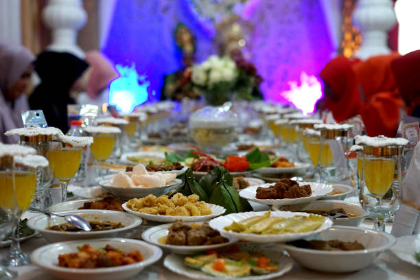 istock Served wedding diner on the table with flowers decorations 1068669764