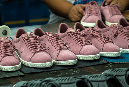 leather shoe making process in footwear factory workshop in Asia