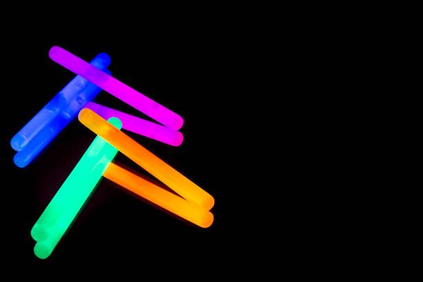 istock Colorful fluorescent light neon big glow stick on mirror reflection black background 1068680336