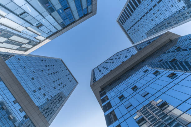 istock Skyscrapers from a low angle view of unrecognized modern buildings 1068681836