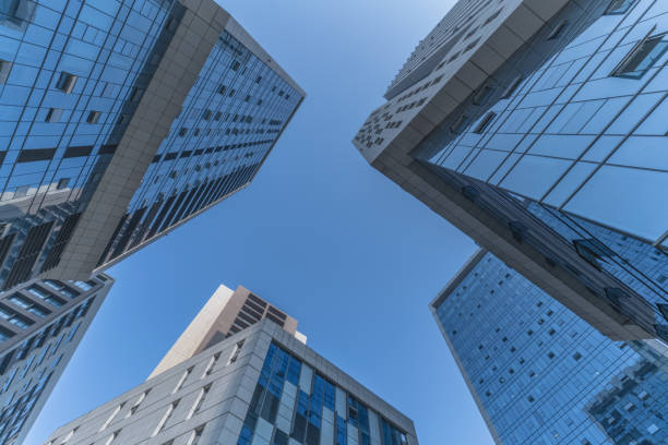 istock Skyscrapers from a low angle view of unrecognized modern buildings 1068681856