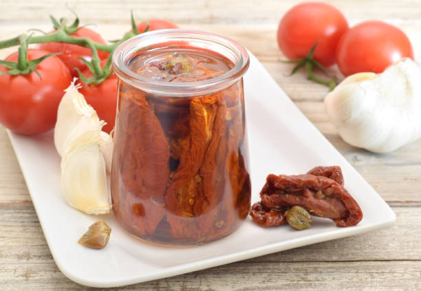 istock Dried tomatoes with oil in glass 1068685822