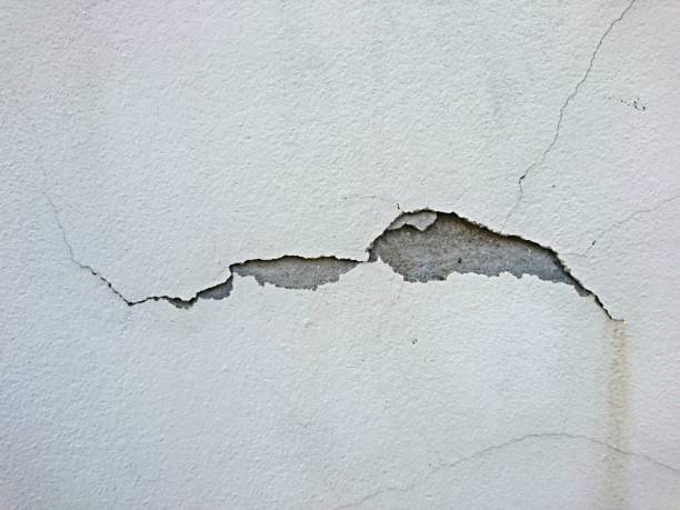 istock Cracked on concrete texture from the wall background 1068687390