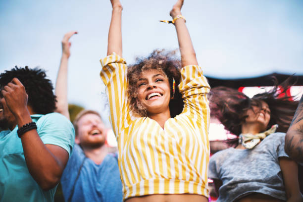 istock People dancing at concert. 1068690966