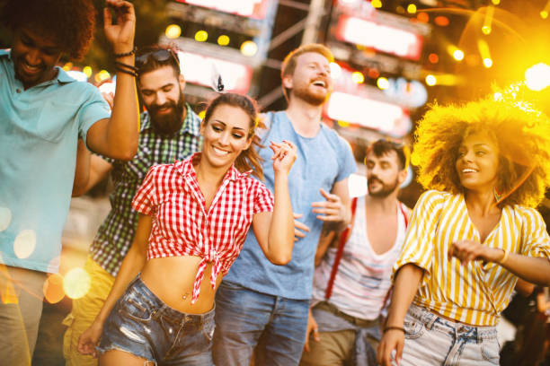 istock People dancing at music festival. 1068691082