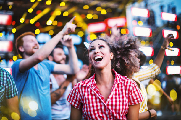 istock People dancing at concert. 1068691162