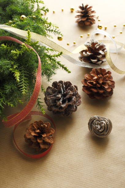 istock Christmas image of wreath, pine cone and ribbon 1068691350