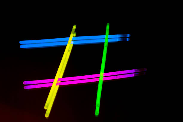 istock Colorful fluorescent light neon big glow stick on mirror reflection black background 1068693014