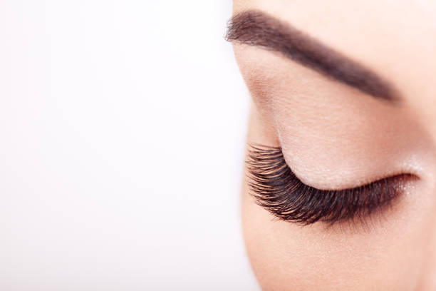 istock Female eye with long false eyelashes 1068693026