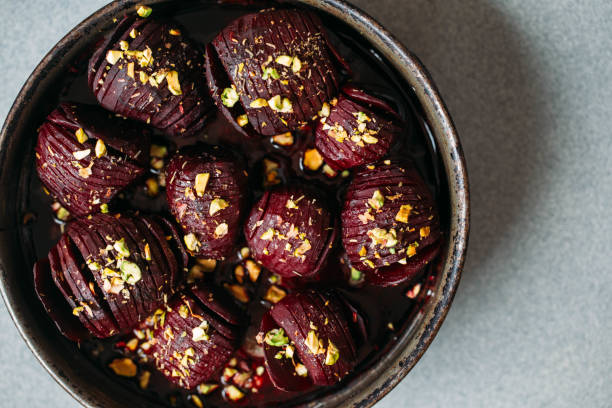 istock Baked whole beet with olive oil, herbs and pistachios 1068700768