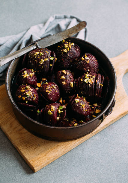istock Baked whole beet with olive oil, herbs and pistachios 1068700986