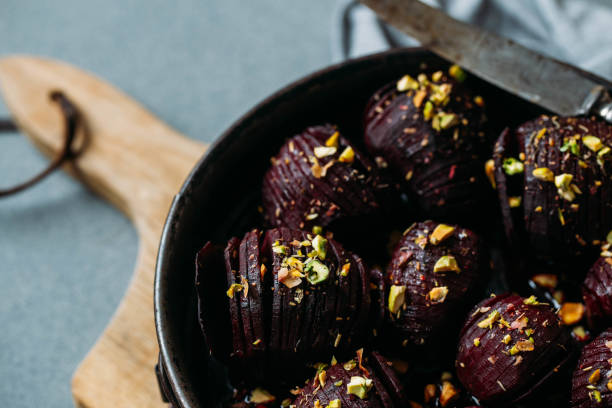 istock Baked whole beet with olive oil, herbs and pistachios 1068700994
