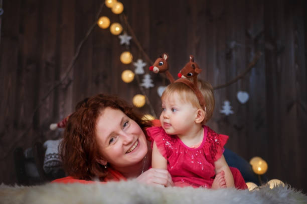 istock Happy child and mom at Christmas. 1068701154