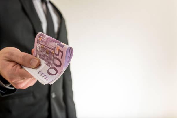 istock Businessman offering you five hundred Euro bills 1068703382