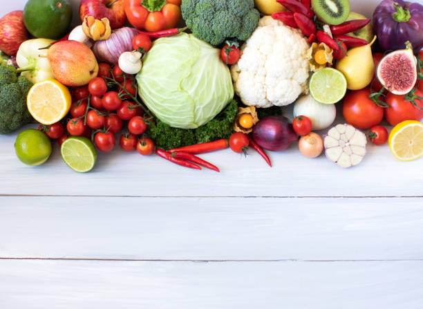 istock Collection of fresh vegetables on the kitchen table top view. 1068705582