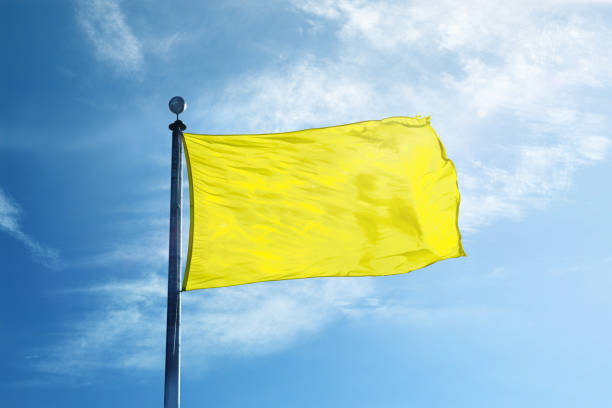 istock Attention yellow flag on the mast 1068718540