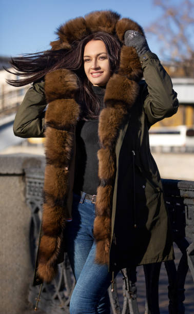 istock girl escapes from the cold in a warm jacket 1068719136