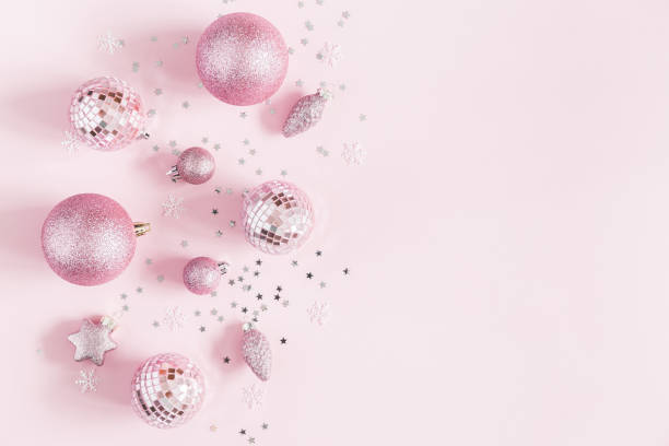 istock Christmas composition. Christmas pink decorations on pastel pink background. Flat lay, top view, copy space 1068719594