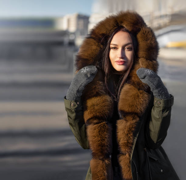 istock model on the street in a warm jacket with fur 1068719664