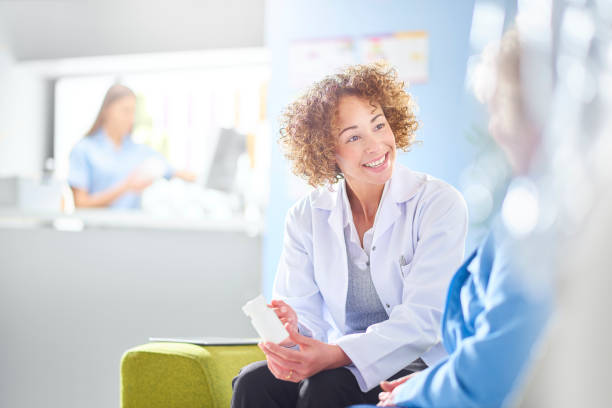 istock pharmacist discussing medication with senior customer 1068719730