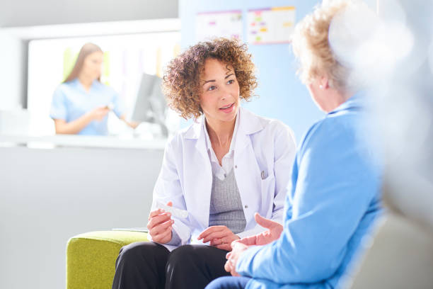 istock pharmacist discussing medication with senior customer 1068719950