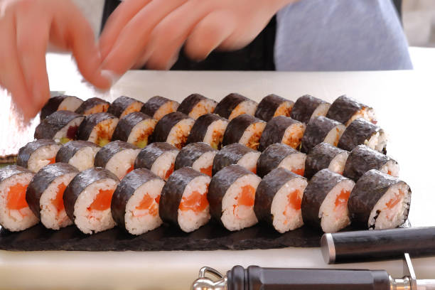 istock ITAMAE  PREPARING A SUSHI MAKI ROLLS TRAY 1068721228
