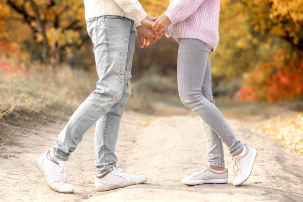legs of couple in love kissing outdoor legs of couple in love kissing outdoor in autumn teen romance stock pictures, royalty-free photos & images