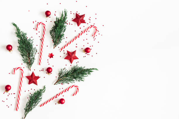 istock Christmas composition. Red decorations, fir tree branches on white background. Christmas, winter, new year concept. Flat lay, top view, copy space 1068721754
