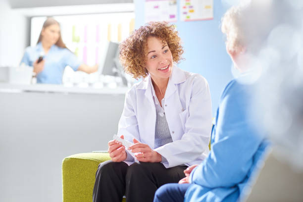istock pharmacist discussing medication with senior customer 1068721890
