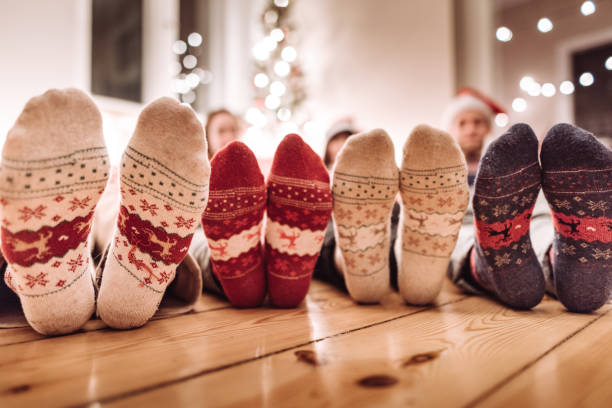 istock friends lying down at home for christmas 1068735444