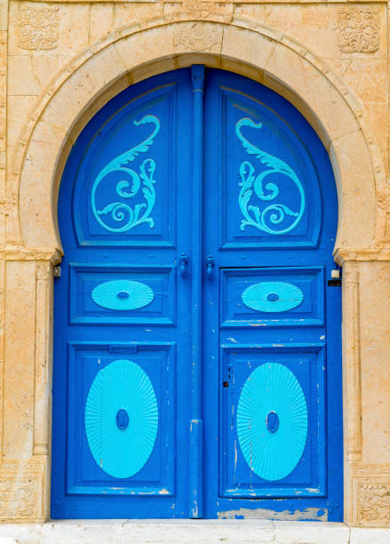 istock Aged Blue door in Andalusian style from Sidi Bou Said 1068736918