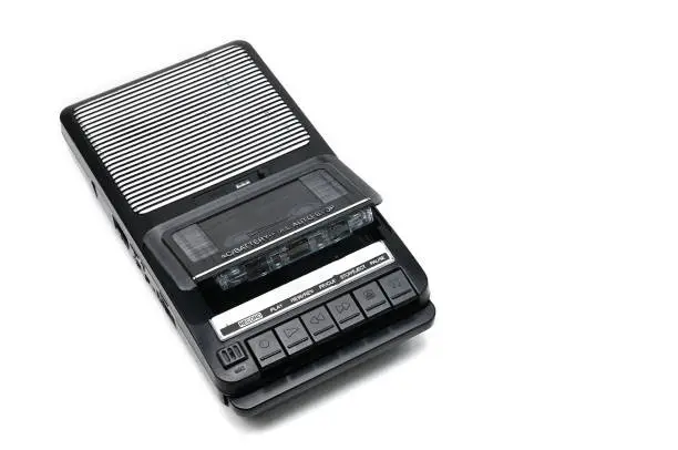 Cassette tape recorder for recording and playing audio cassettes on an white isolated background.Vintage