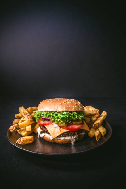 istock Delicious burger on wood 1068741192