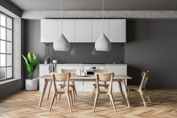 istock Front view of gray kitchen with table and chairs 1068743082