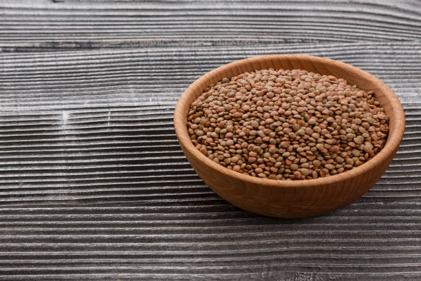istock raw lentils on a wooden rustic background 1068748660