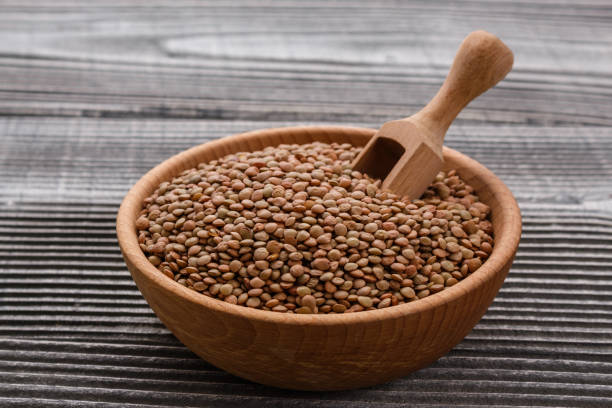istock raw lentils on a wooden rustic background 1068748702