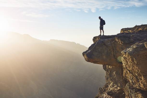 Tourist on the edge of cliff