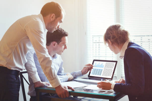 istock business people working on project together in the office, teamwork concept 1068752376