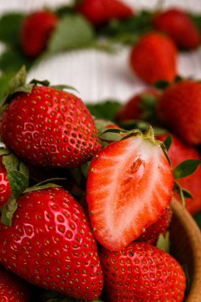 istock Juicy fresh strawberry on a rustic wooden background 1068755486