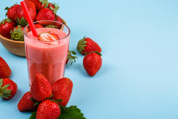 istock fresh strawberrysmoothie or milkshake on a delicately blue background 1068759016