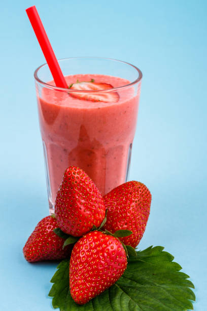 istock fresh strawberrysmoothie or milkshake on a delicately blue background 1068759030