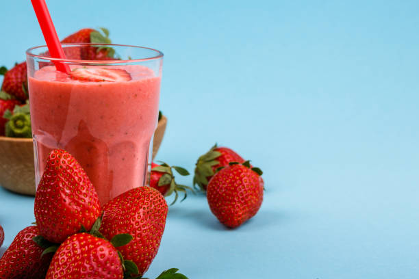istock fresh strawberrysmoothie or milkshake on a delicately blue background 1068760274