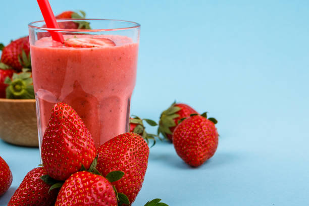 istock fresh strawberrysmoothie or milkshake on a delicately blue background 1068760290