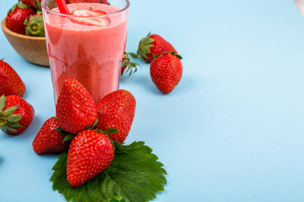 istock fresh strawberrysmoothie or milkshake on a delicately blue background 1068760308