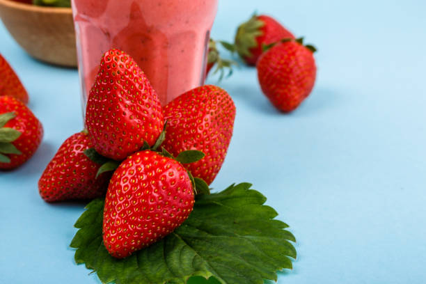 istock fresh strawberrysmoothie or milkshake on a delicately blue background 1068760312
