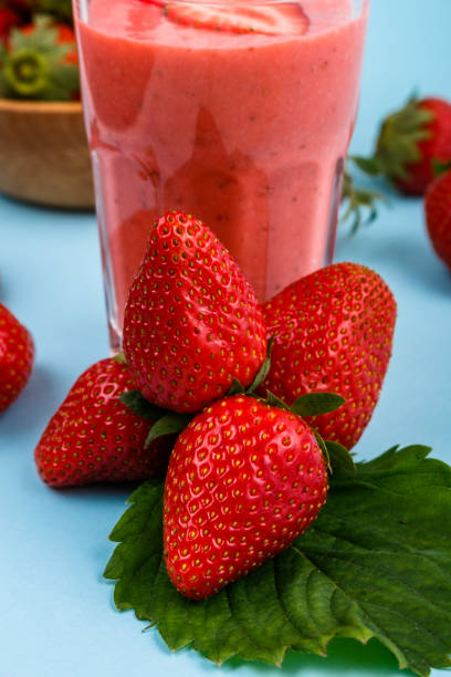 istock fresh strawberrysmoothie or milkshake on a delicately blue background 1068760316