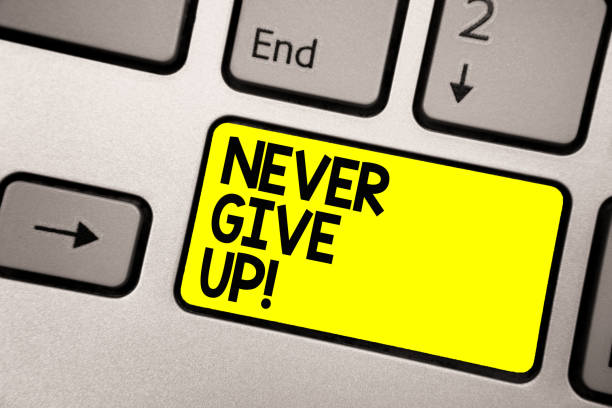 istock Word writing text Never Give Up. Business concept for Keep trying until you succeed follow your dreams goals Keyboard yellow key Intention create computer computing reflection document. 1068763242