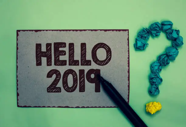 Photo of Word writing text Hello 2019. Business concept for Hoping for a greatness to happen for the coming new year Gray paper marker crumpled papers forming question mark green background.