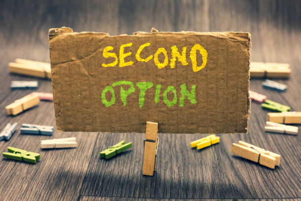 istock Writing note showing Second Option. Business photo showcasing Next Fiddle Not a priority Next Alternative Opportunity Clothespin holding paperboard important communicating message ideas. 1068763454
